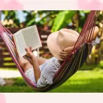 must read books on vacation. Girl reading book in hammock