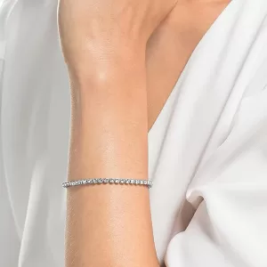 Arm wearing aSwarovski tennis bracelet a memorable jewelry gift 