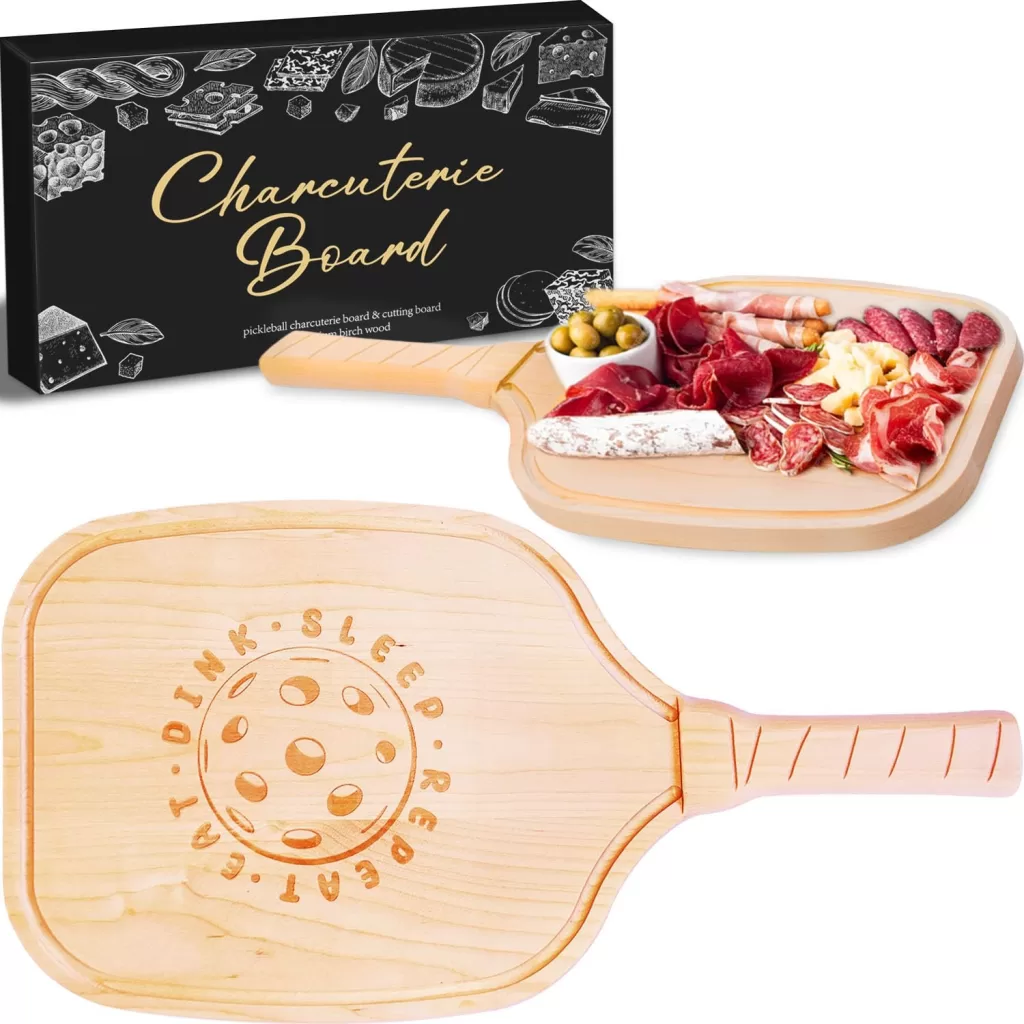 Charcuterie board shaped like a Pickleball paddle