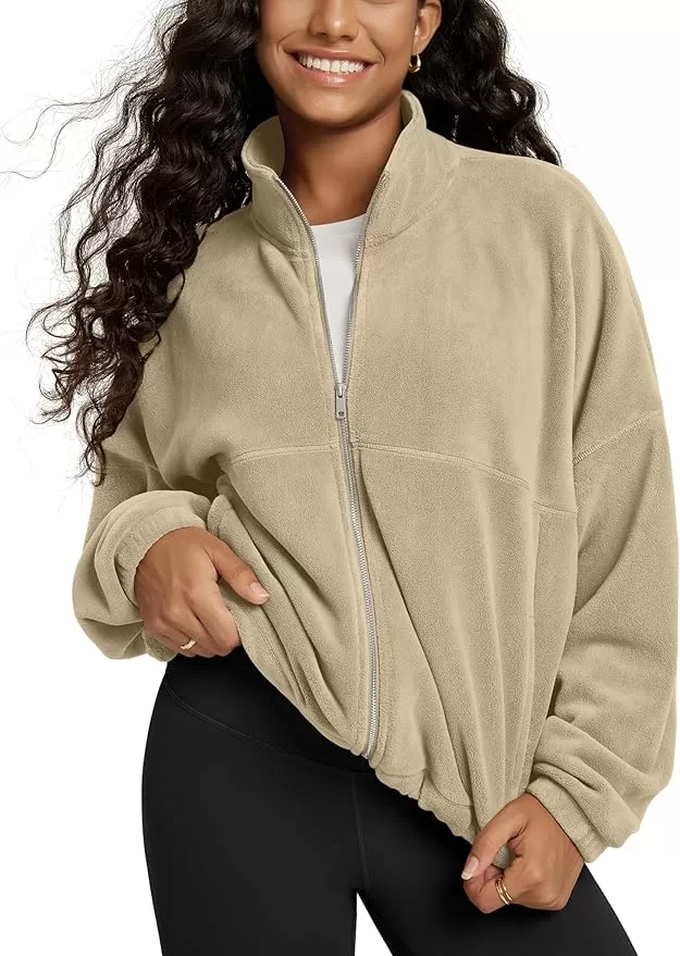 a soft and comfortable zippered fleece. Tan is shown