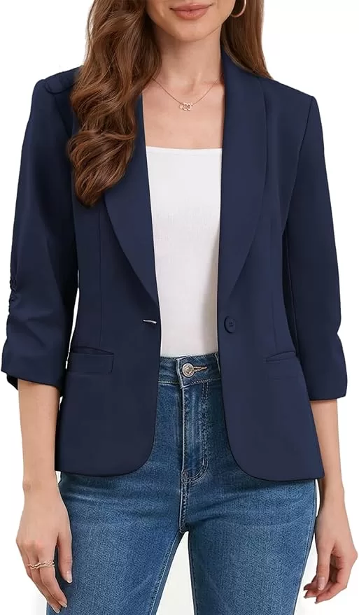 Navy blue jacket over a white shell and jeans