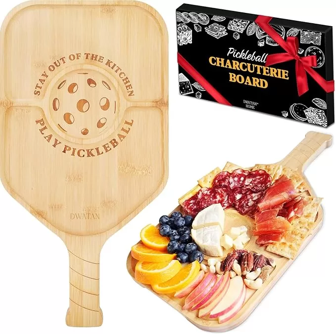 Pickleball paddle shaped charuterie board with cheese and fruit
